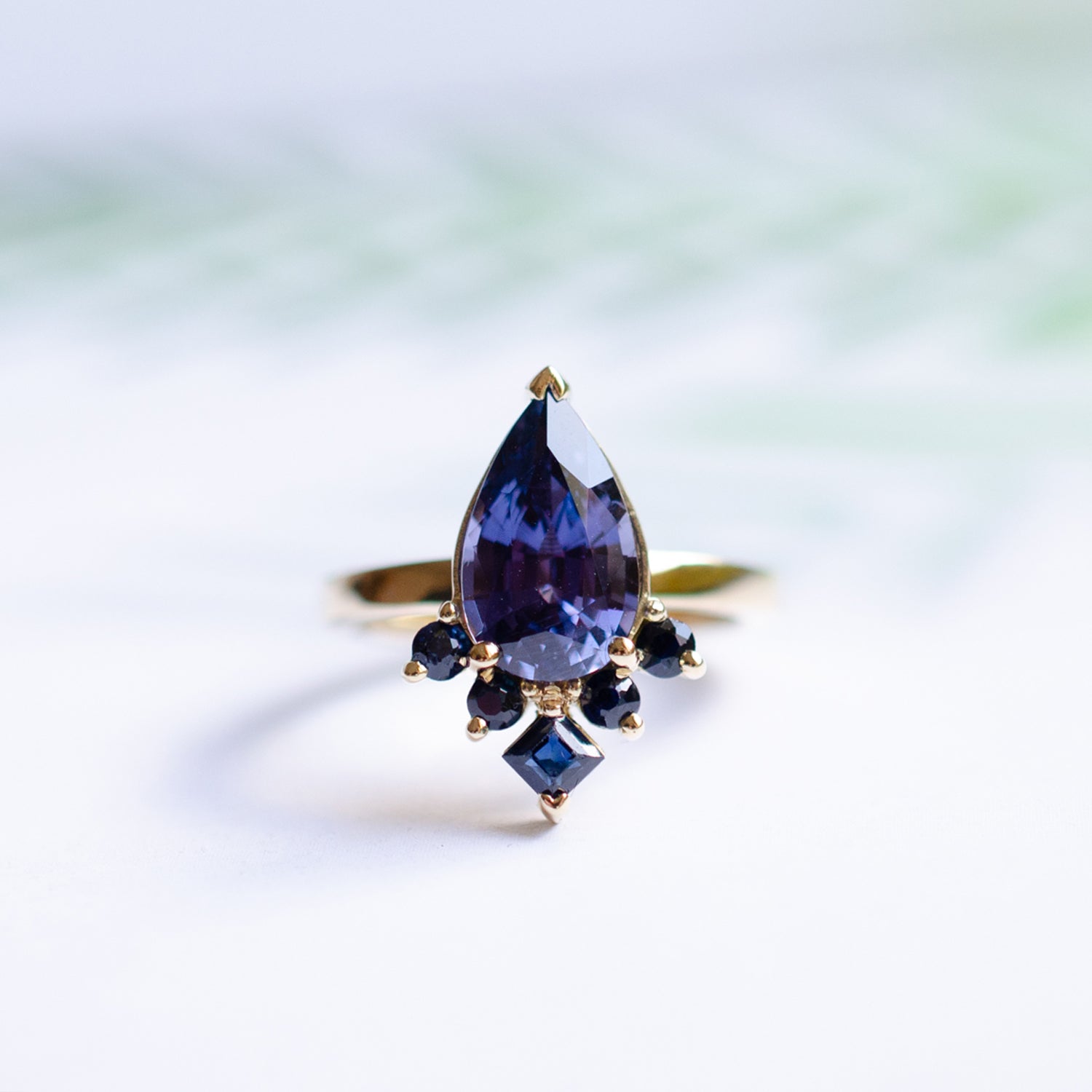 Mei-Li_Rose_bespoke_jewellery_engagement_ring_purple sapphire pear cut stone